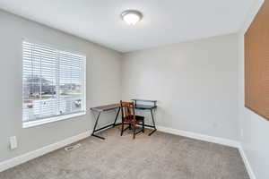 View of carpeted home office