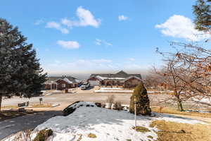 View of yard layered in snow