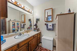 Bathroom with tile patterned floors and vanity