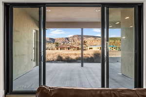 Doorway to outside with a mountain view