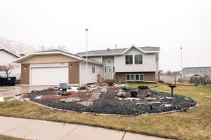 The front of the home features a mountain view, RV parking, and a garage.