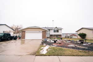 View of front of property with a garage