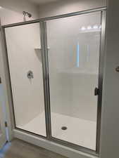 Bathroom with a shower with shower door