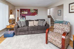 Living room with hardwood / wood-style floors