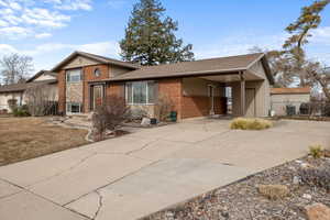 View of front of house with a carport