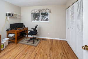 Office area with light hardwood / wood-style flooring