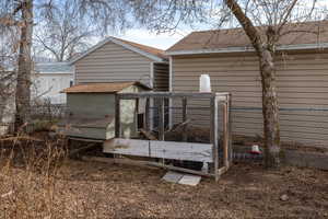 Back of house with an outbuilding