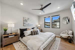 Bedroom with ceiling fan and light hardwood / wood-style floors