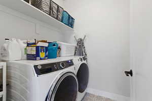 Laundry area featuring washer and clothes dryer