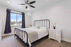 Carpeted bedroom with ceiling fan