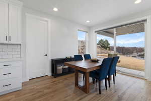 Dining room with wood-type flooring