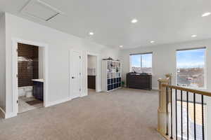 Carpeted bedroom with ensuite bath