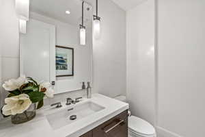 Bathroom featuring vanity and toilet