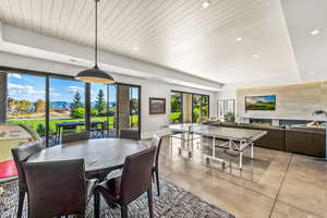 Dining room featuring wood ceiling and a tray ceiling