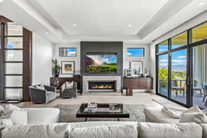 Tiled living room with a tray ceiling