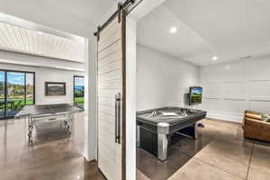 Recreation room with a barn door