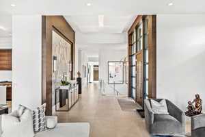 Hallway with light tile patterned floors