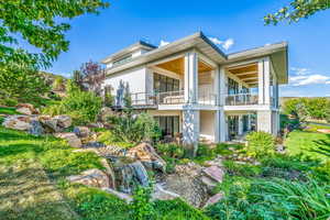 Back of property featuring a balcony