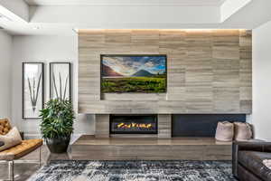 Living area with a tiled fireplace