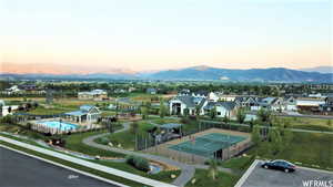 Aerial view at dusk featuring a mountain view