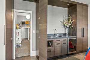 Bar with sink and beverage cooler