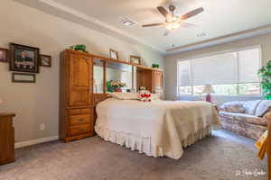 Bedroom with light carpet and ceiling fan