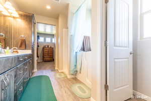 Bathroom with vanity and hardwood / wood-style floors