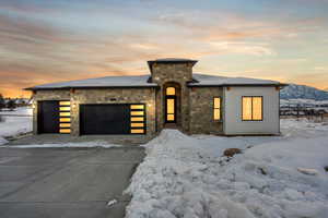 View of front of home at dusk