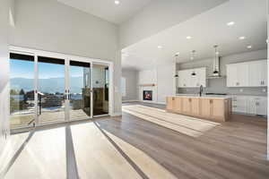 Covered Outdoor living area with fireplace directly off the kitchen and great room