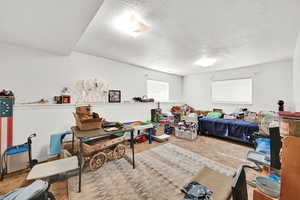 Bedroom featuring carpet floors and a textured ceiling