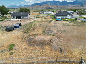 Birds eye view of property with a mountain view and a rural view