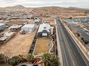 Birds eye view of property with a mountain view