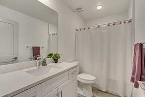 Bathroom with vanity and toilet