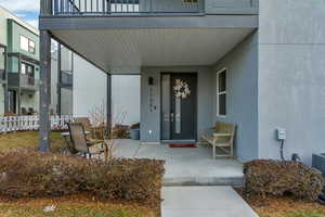 Property entrance featuring a patio