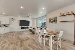 Dining area featuring ceiling fan and light wood-type flooring