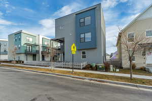 View of front of house featuring central AC unit