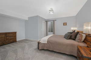 And yet another large bedroom featuring neutral carpeting and walk-in closet