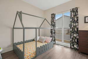 Bright, airy bedroom featuring a convenient  walk-in closet.