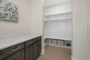 Mud area, attached to the laundry room, with an abundance of storage.