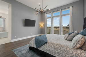 Generous windows fill the primary bedroom with natural light and frame beautiful views.