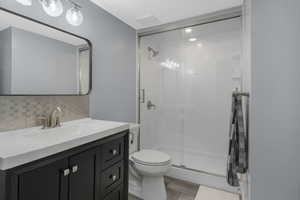 Bathroom designed to serve the downstairs bedrooms, featuring a beautiful walk-in shower.