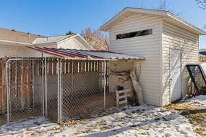 Exterior space featuring an outbuilding