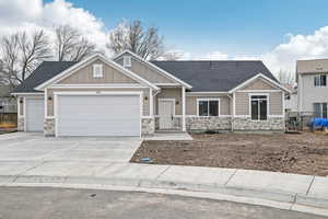 Craftsman inspired home featuring a garage