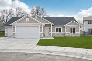 Craftsman-style home with board and batten siding and stone siding