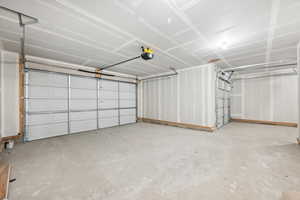 Garage featuring a garage door opener