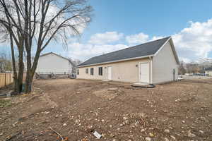 Back of property with a mountain view