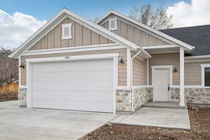 View of front of property featuring a garage