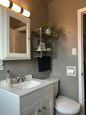 Bathroom featuring vanity and toilet