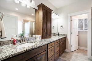 Bathroom with walk in shower and vanity