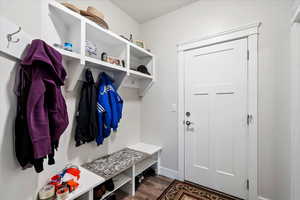 Mudroom with dark wood-type flooring